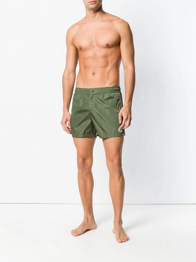 Shop Moncler Striped Trim Swim Shorts In Green