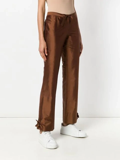 Shop Romeo Gigli Vintage Knot Detailing Bootcut Trousers - Brown