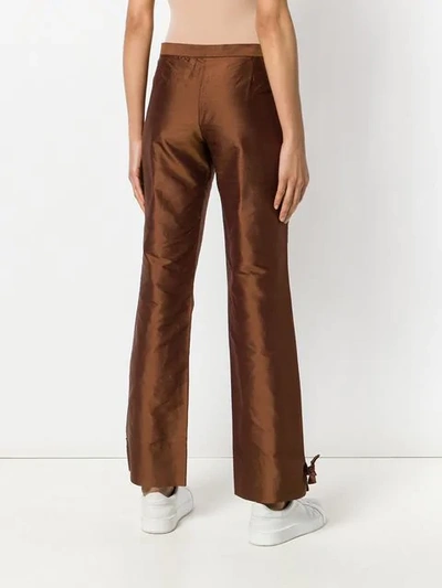 Shop Romeo Gigli Vintage Knot Detailing Bootcut Trousers - Brown