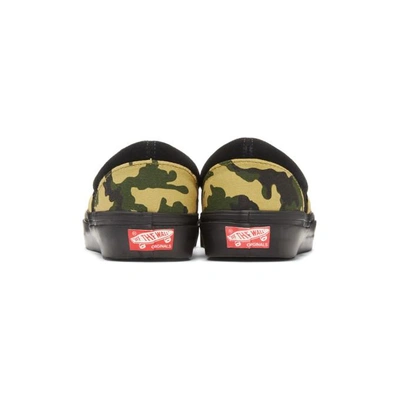 Shop Vans Black Camo Og Classic Slip-on Sneakers In Camo/black