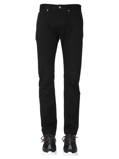 Shop Versace Slim Fit Jeans In Black