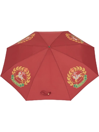 Shop Burberry Crest Print Folding Umbrella - Red