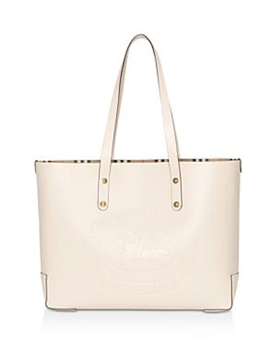 Shop Burberry Small Embossed Crest Leather Tote In Limestone Pink/gold