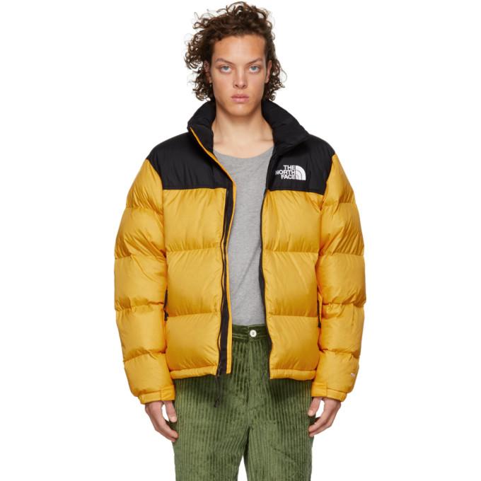 yellow and black north face puffer