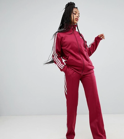 Shop Adidas Originals Three Stripe Wide Leg Track Pants In Ruby - Red