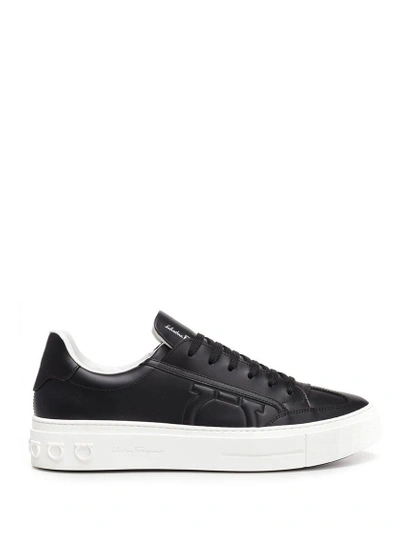 Shop Ferragamo Salvatore  Logo Embossed Sneakers In Black