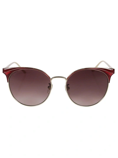Shop Gucci Cat Eye Sunglasses In Gold/red