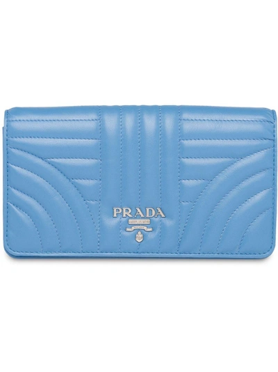 Shop Prada Quilted Logo Clutch In Blue