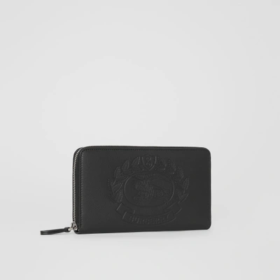 Shop Burberry Embossed Crest Leather Ziparound Wallet In Black