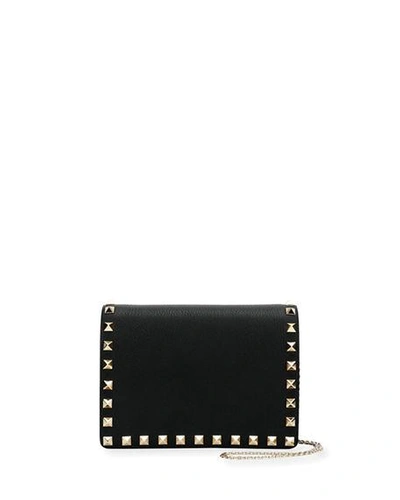 Shop Valentino Rockstud Vitello Chain Clutch Bag In Black