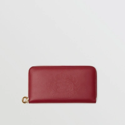 Shop Burberry Embossed Crest Two-tone Leather Ziparound Wallet In Crimson