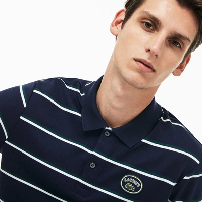 Shop Lacoste Men's Regular Fit Striped Cotton Interlock Polo In Navy Blue / White / Green