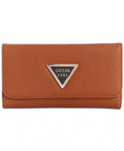 Shop Guess Lauri Boxed Slim Clutch Wallet In Cognac Multi/gold