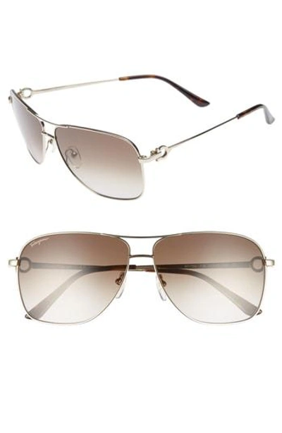 Shop Ferragamo Gancio 61mm Aviator Sunglasses - Shiny Gold