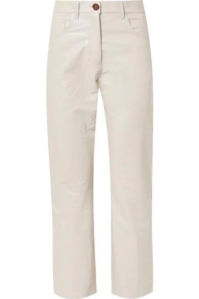 Shop Nanushka Ivy Cropped Croc-effect Vegan Leather Straight-leg Pants In Cream
