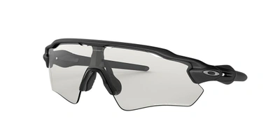 Shop Oakley Man Sunglasses Oo9208 Radar® Ev Path® In Clear To Black Iridium Photochromic