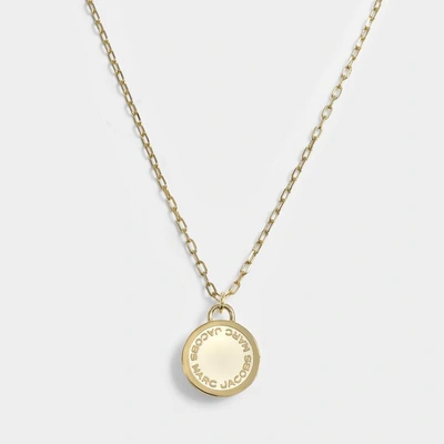 Shop Marc Jacobs Logo Disc Pendant Necklace In Cream Brass - Jewelry Us