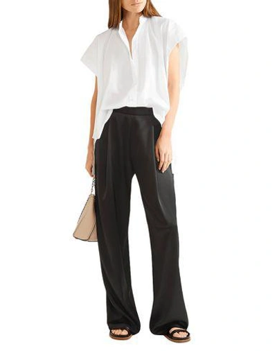 Shop Helmut Lang Solid Color Shirts & Blouses In White