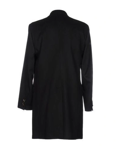 Shop Dolce & Gabbana Coats In Black