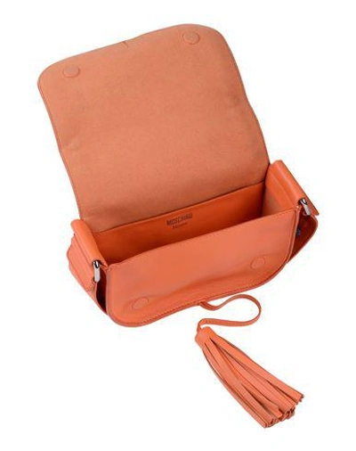Shop Moschino Cross-body Bags In Orange