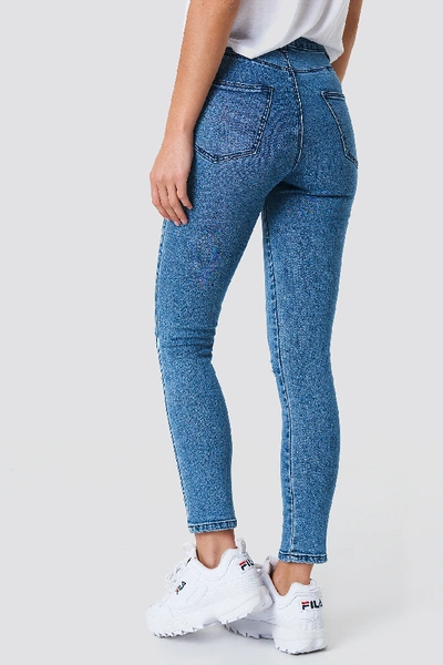 Shop Na-kd Highwaist Ripped Knee Skinny Jeans - Blue In Mid Blue