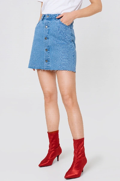Shop Na-kd Button Up Raw Hem Denim Skirt Blue In Light Blue