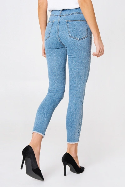Shop Na-kd Highwaist Skinny Fray Hem Jeans - Blue In Light Blue