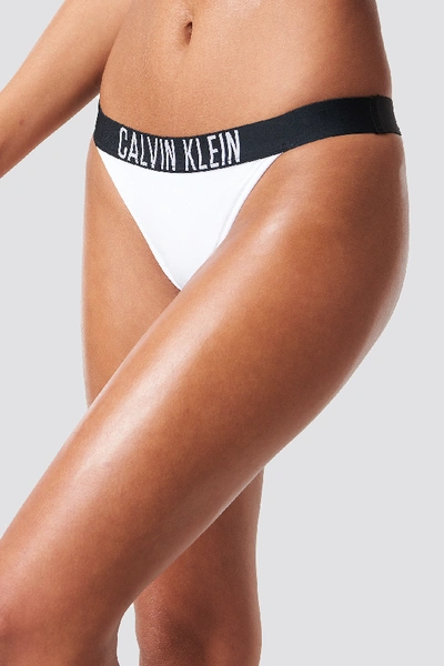 Shop Calvin Klein Brazilian Bikini Bottom - White