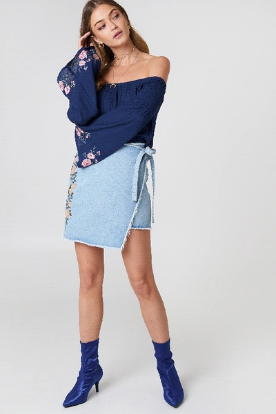 Shop Na-kd Embroidered Wrap Denim Skirt - Blue In Light Blue Denim