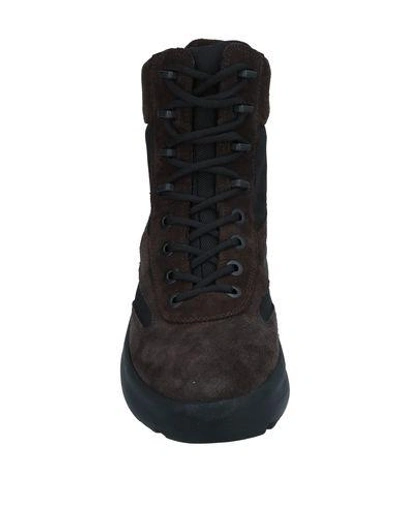 Shop Yeezy Boots In Dark Brown