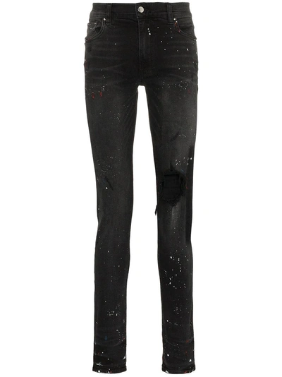 Shop Amiri Paint Splattered Distressed Skinny Jeans - Black