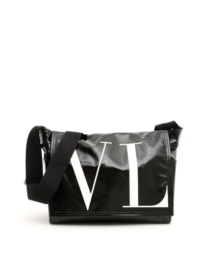 Shop Valentino Vltn Messenger Bag In Nero Bianco