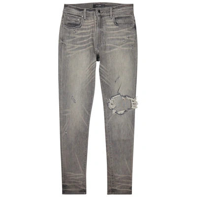 Shop Amiri Broken Distressed Skinny Jeans