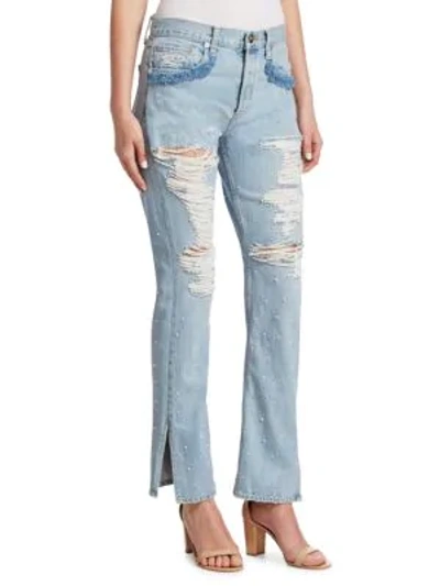 Shop Jonathan Simkhai Distressed Beaded Jeans In Chambray