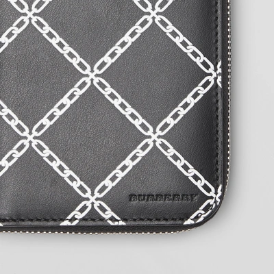 Shop Burberry Link Print Leather Ziparound Wallet In Black/chain