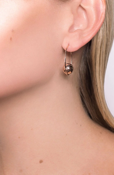 Shop Lana Jewelry Hollow Ball Large Hoop Earrings In Gold