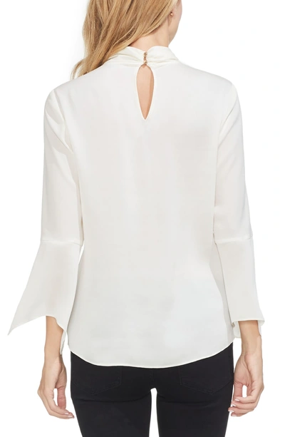 Shop Vince Camuto Twist Neck Handkerchief Sleeve Satin Top In Pearl Ivory