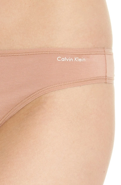 Shop Calvin Klein Form Thong In Warm Camel