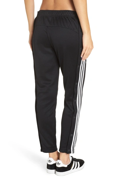 Shop Adidas Originals Tricot Snap Pants In Black/ White/ White