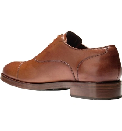 Shop Cole Haan Harrison Grand Cap Toe Oxford In British Tan Leather