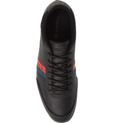 Shop Lacoste Storda Low Top Sneaker In Black/ Red