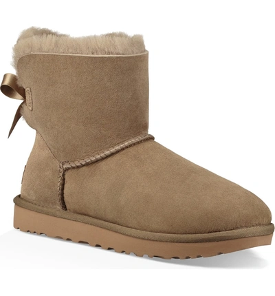 Shop Ugg Mini Bailey Bow Ii Genuine Shearling Bootie In Antelope Suede