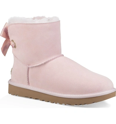 Shop Ugg Customizable Bailey Bow Mini Genuine Shearling Bootie In Seashell Pink Suede
