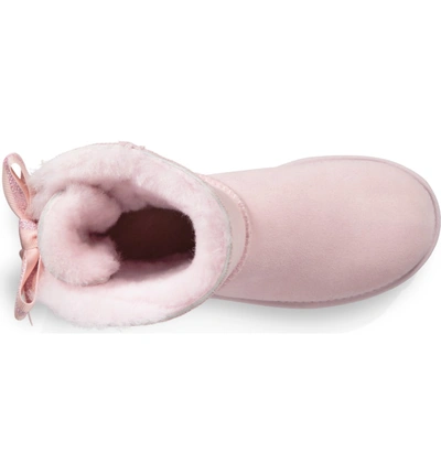 Shop Ugg Customizable Bailey Bow Mini Genuine Shearling Bootie In Seashell Pink Suede