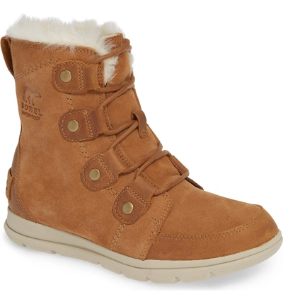 Shop Sorel Explorer Joan Waterproof Boot With Faux Fur Collar In Camel Brown