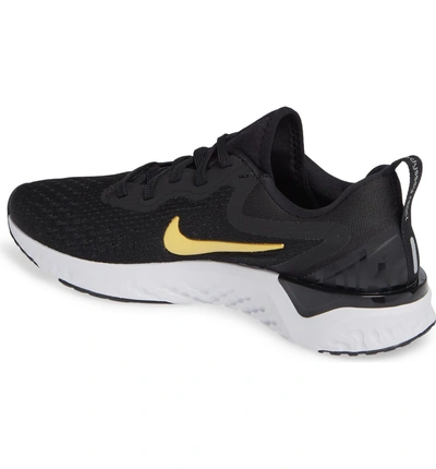 Shop Nike Odyssey React Running Shoe In Black/ Metallic Gold-vast Grey