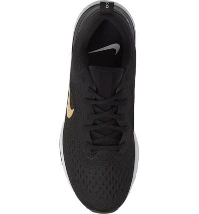 Shop Nike Odyssey React Running Shoe In Black/ Metallic Gold-vast Grey