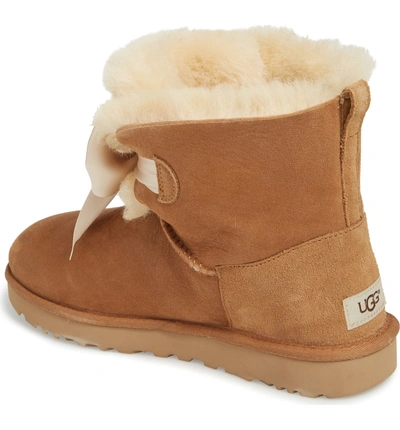 Shop Ugg Mini Gita Bow Boot In Chestnut