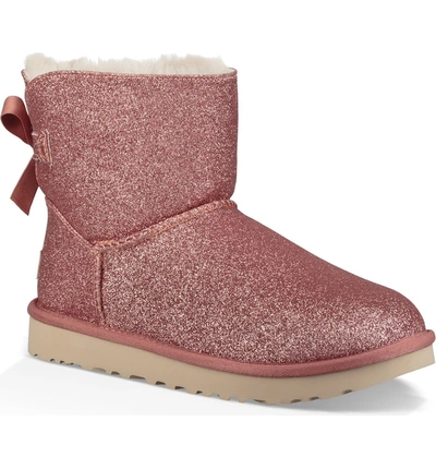 Shop Ugg Mini Bailey Bow Sparkle Genuine Shearling Boot In Pink