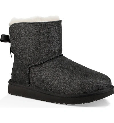 Shop Ugg Mini Bailey Bow Sparkle Genuine Shearling Boot In Black